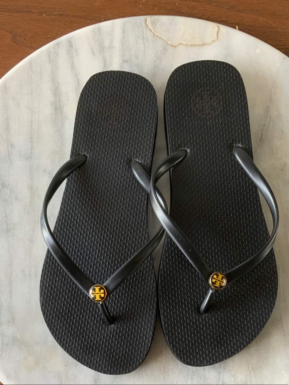 Tory Burch Black Flip Flops with Gold Logo Medallions